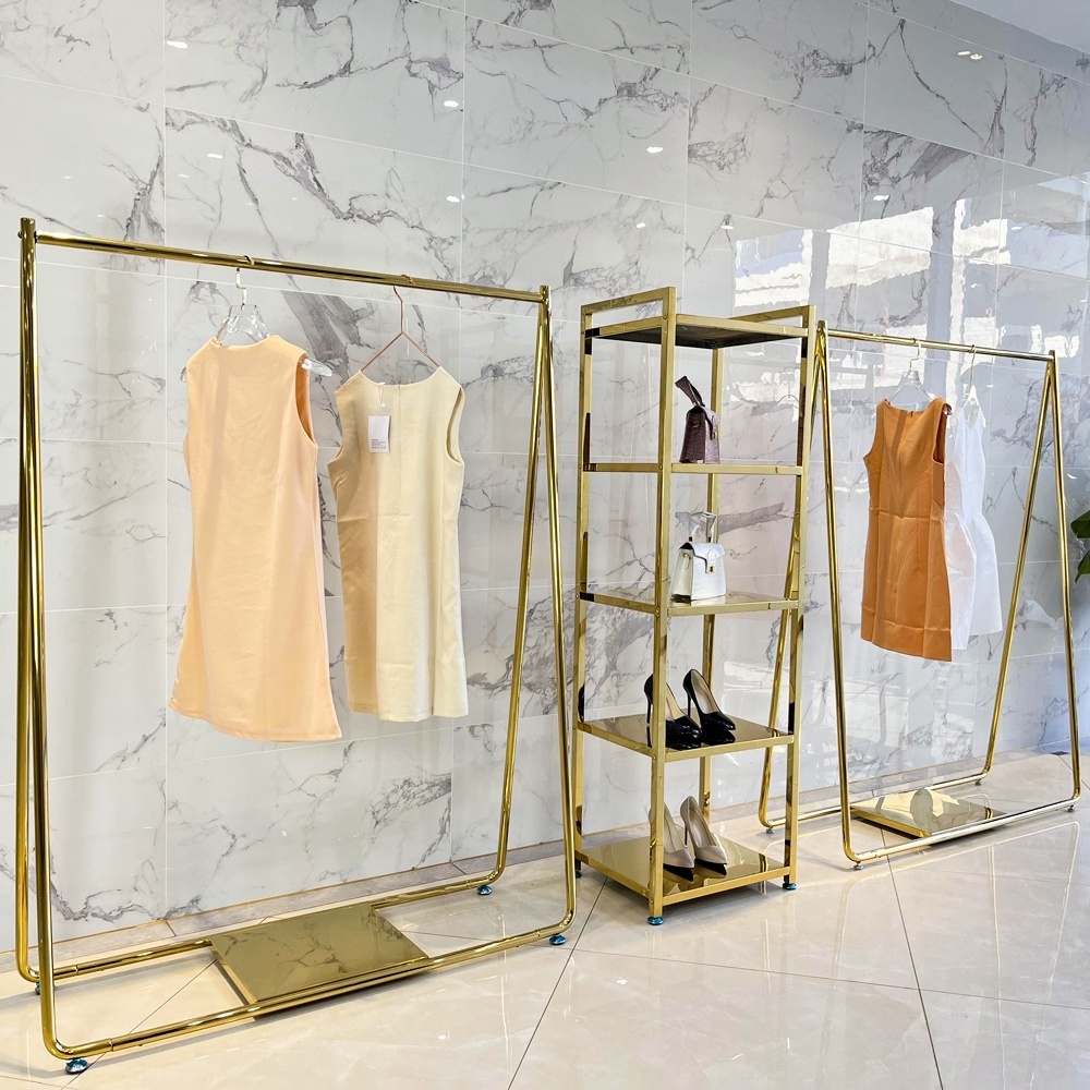 Modern design metal side shiny gold retail garment store display table golden clothing display racks for clothes shop shelf