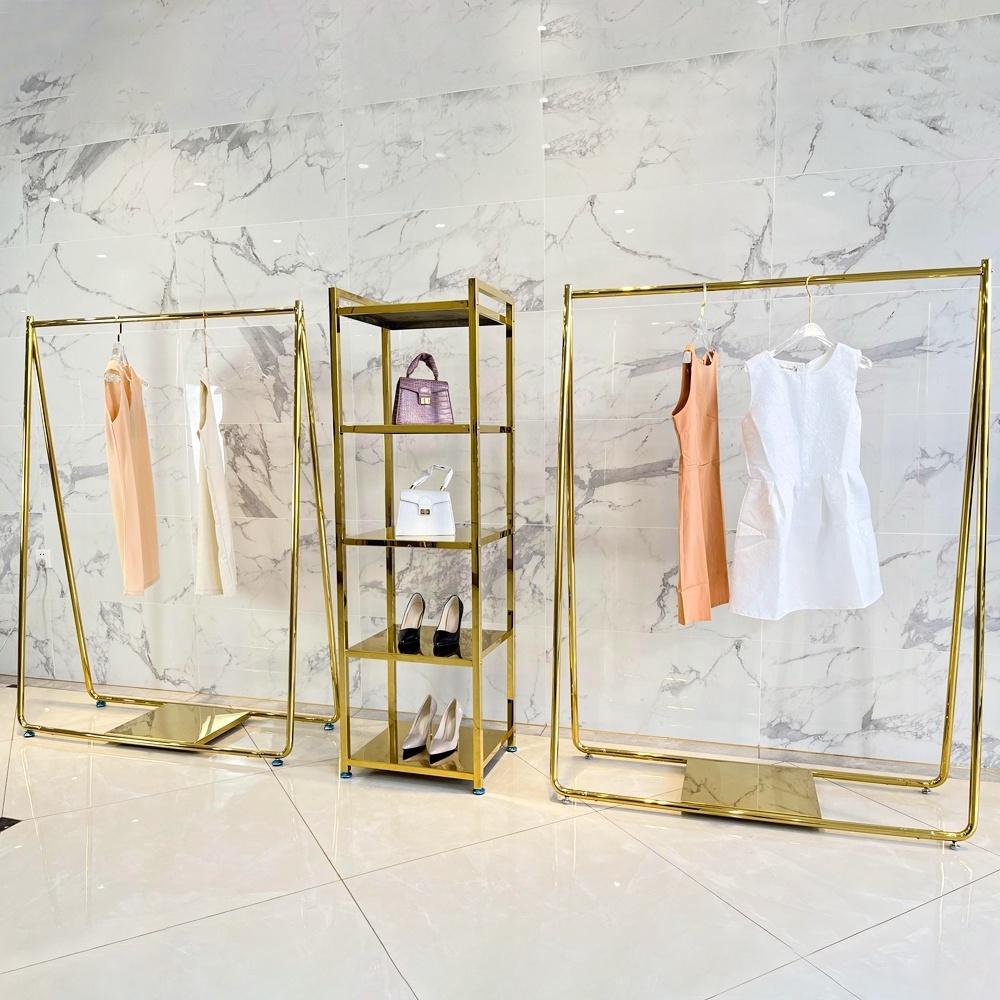 Modern design metal side shiny gold retail garment store display table golden clothing display racks for clothes shop shelf