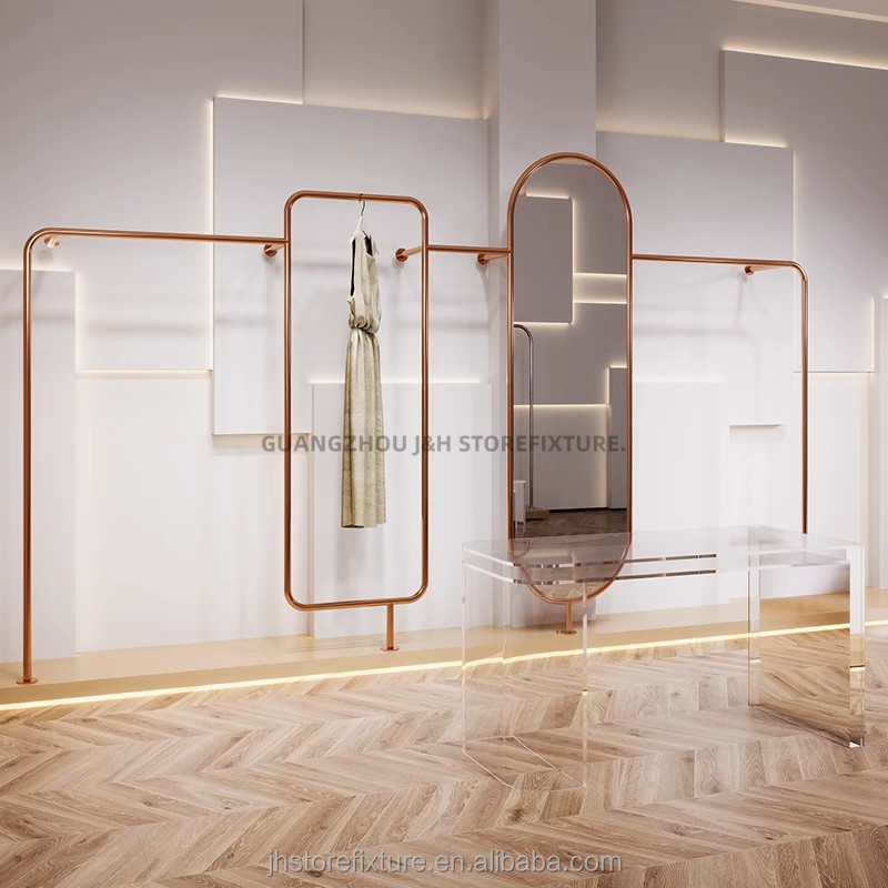 Wall mounted store display rack for clothes rose gold clothing rack display with mirror for boutique display dress