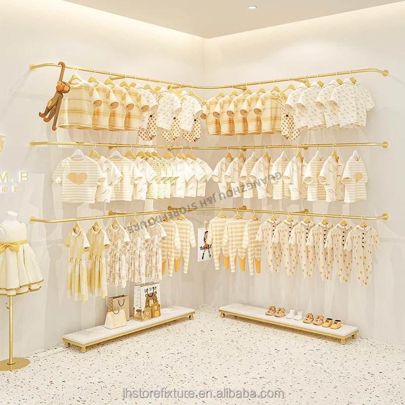 Interior design hanging rack clothes display wall mounted stainless steel gold clothes display rack for shop custom