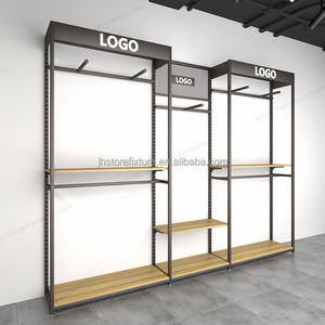 adjustable height showroom display rack for man wood retail clothing store fixtures sport store interior design With Best Price