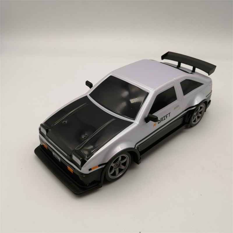 2.4G 1:24 RC Car Drift 4WD Remote Control Drift Racing Car PVC Cover Body with Replaceable Tires and Modula Battery