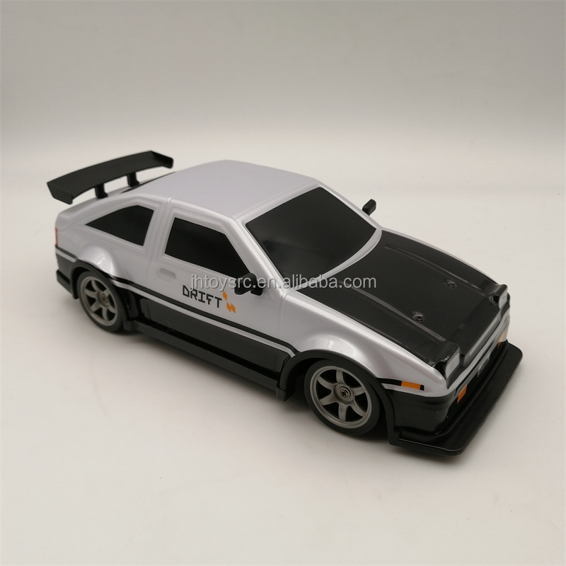 2.4G 1:24 RC Car Drift 4WD Remote Control Drift Racing Car PVC Cover Body with Replaceable Tires and Modula Battery