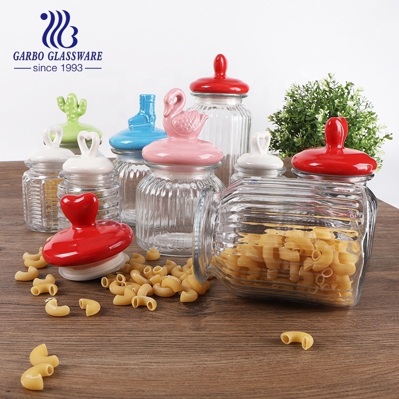 Home Kitchen Use Embossed Glass Storage Jar with Engraved Pattern Glass Storage Cookie Peanut Bottle with Animal Ceramic Lid