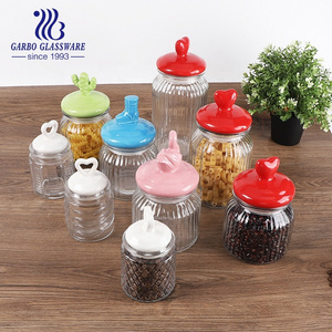 Home Kitchen Use Embossed Glass Storage Jar with Engraved Pattern Glass Storage Cookie Peanut Bottle with Animal Ceramic Lid