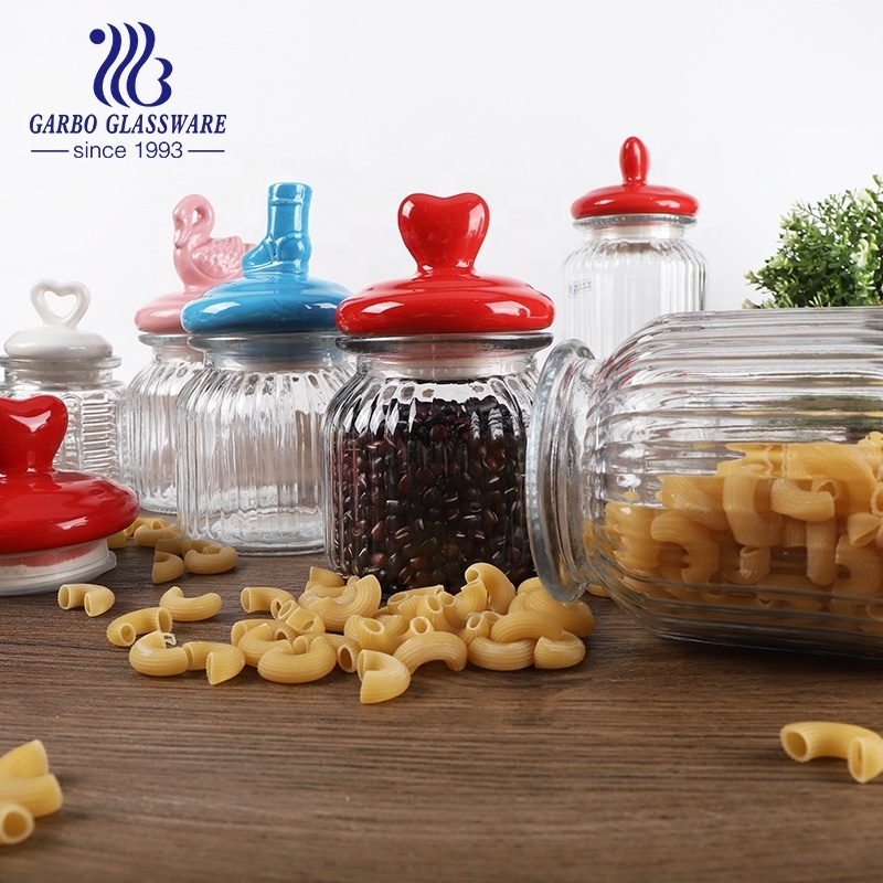 Home Kitchen Use Embossed Glass Storage Jar with Engraved Pattern Glass Storage Cookie Peanut Bottle with Animal Ceramic Lid