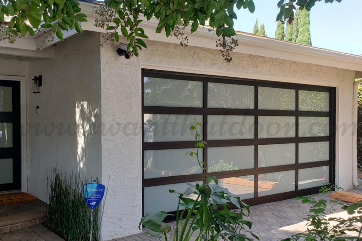 Automatic black aluminum frosted glass sectional sliding gate used commercial garage door