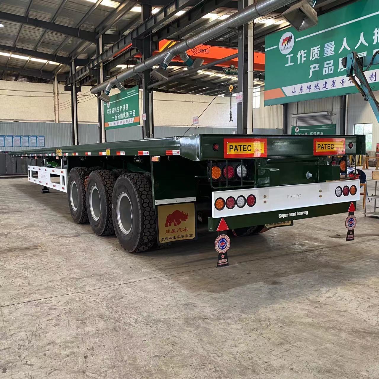 China famous brand shipping container 3 Axles 40 FT Flatbed  bed semi truck trailer 50 ton for sale