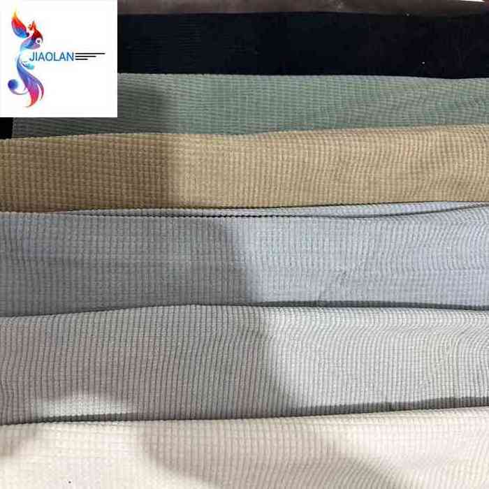 Hot selling polyester woven plain dyed corduroy stock fabric in China textile