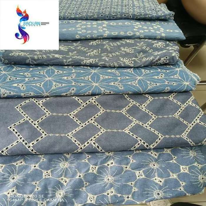 Customized order embroidered denim jeans fabric wholesale cutwork eyelet embroidery denim fabric denim stock lots