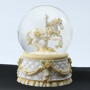 New Popular Design Resin Handcrafts Carousel Snow Globes With Yellow Base Decor