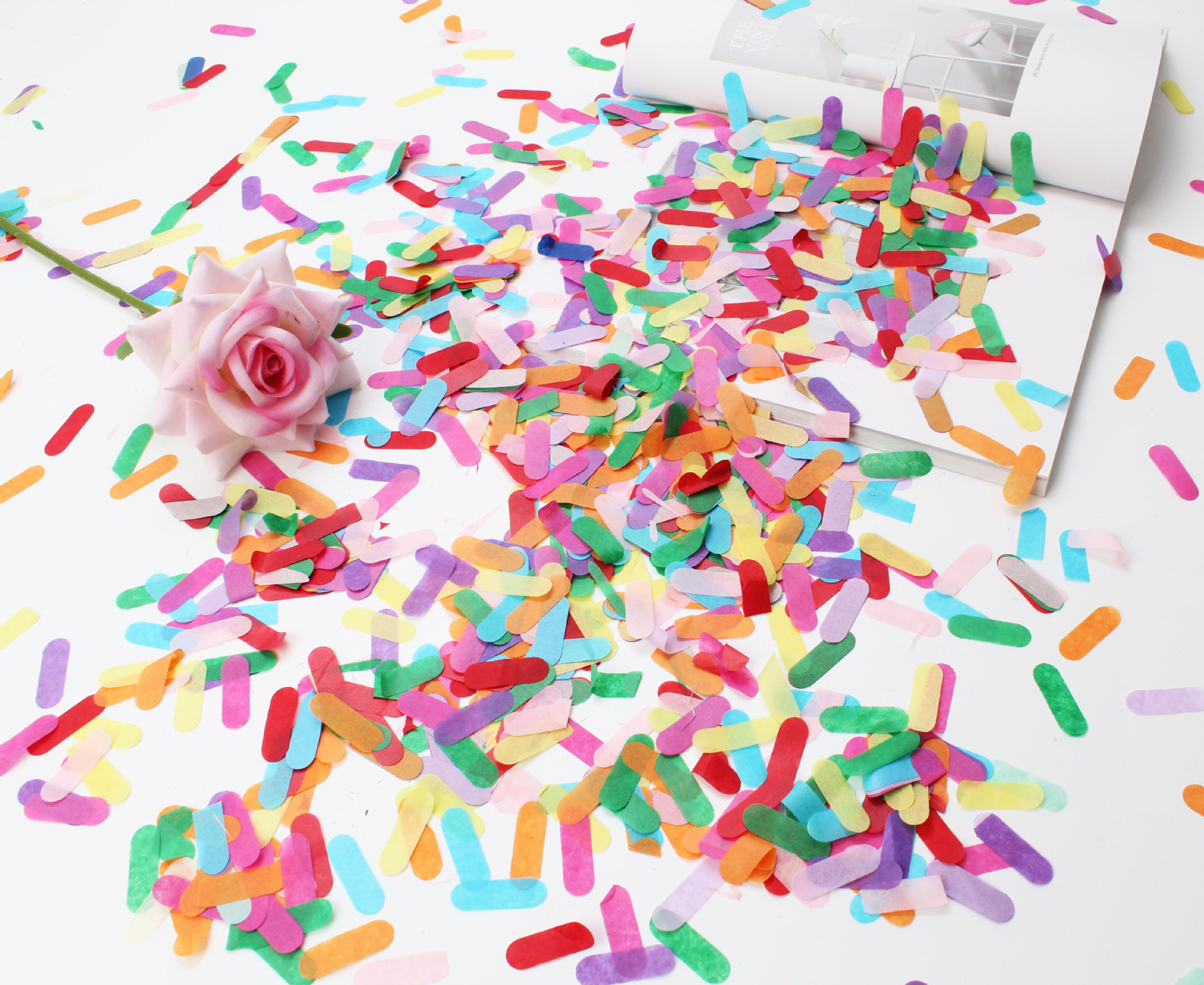 Ice cream colored strips of confetti throwing confetti Bobo ball balloons filled with sequin paper