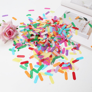 Ice cream colored strips of confetti throwing confetti Bobo ball balloons filled with sequin paper