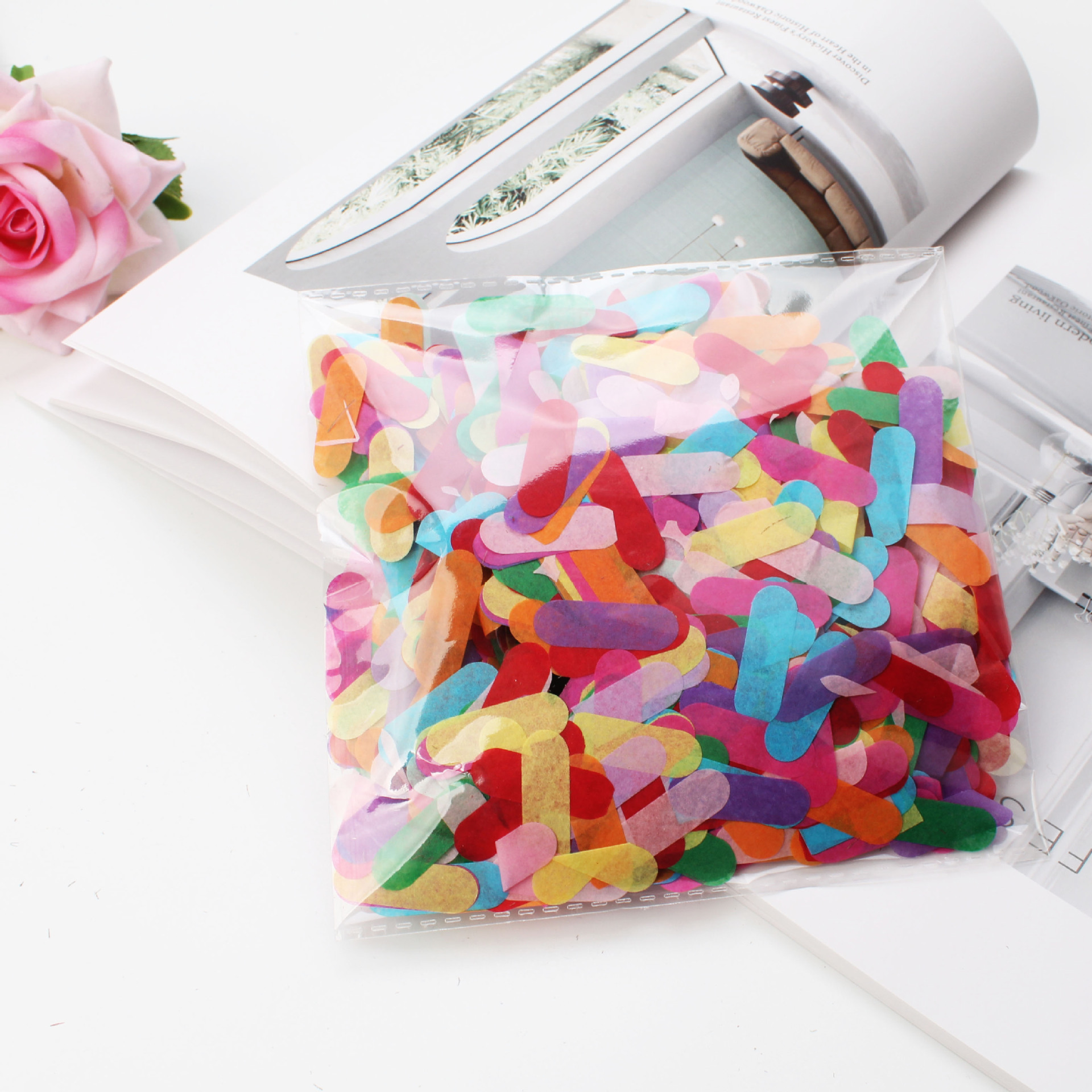 Ice cream colored strips of confetti throwing confetti Bobo ball balloons filled with sequin paper