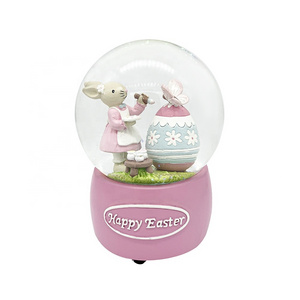 OEM & ODM Kids favor easter bunny gifts musical resin glass snow globe for Easter