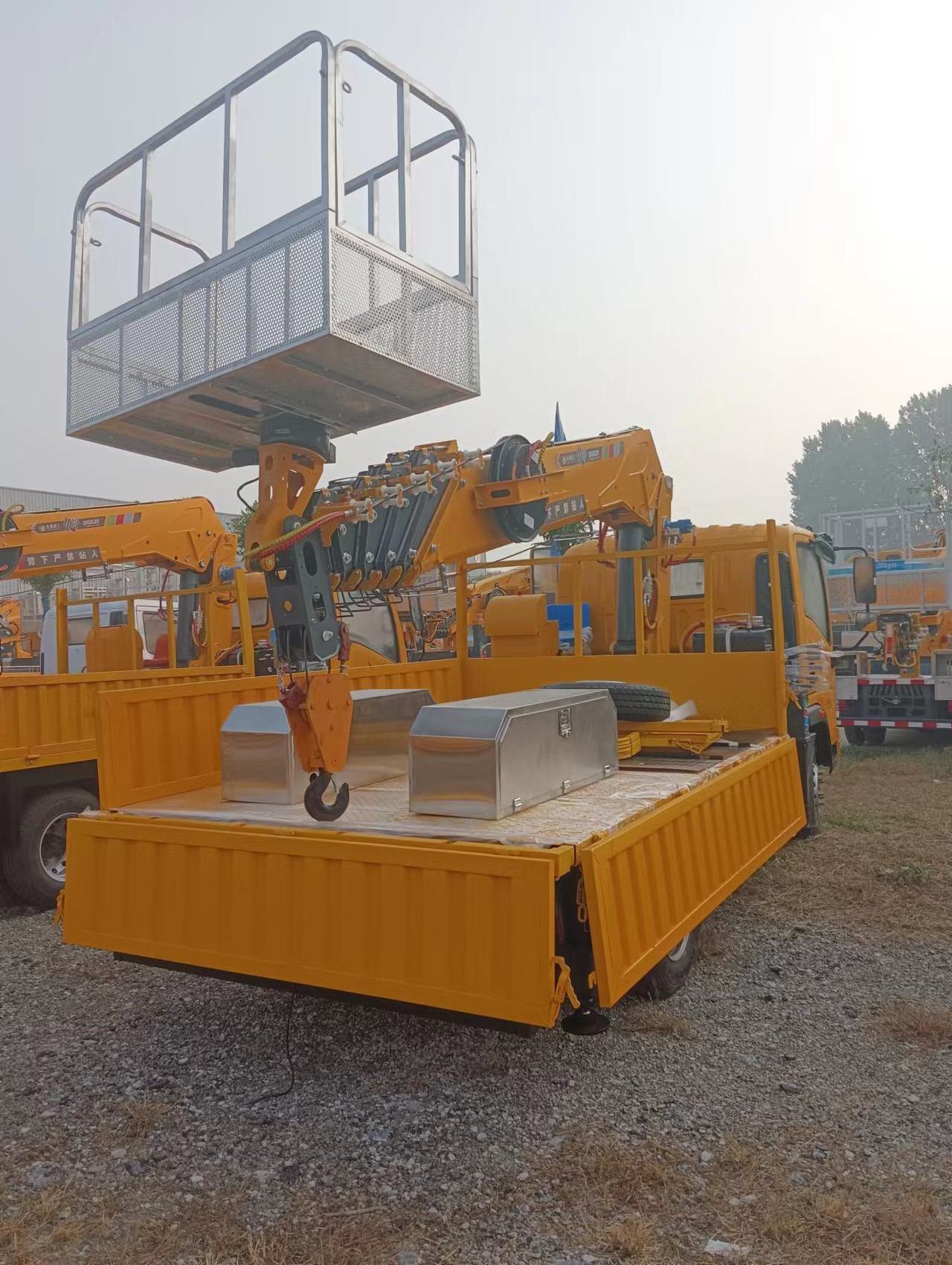 Multi-purpose truck crane with telescopic boom and working platform on HOMAN chassis