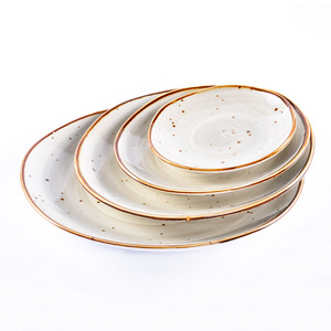 Wholesale high quality different size white color glazed crockery ceramic porcelain crackle dessert plates and dishes set