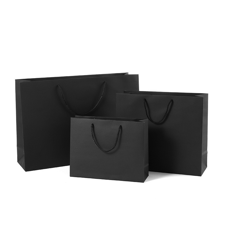 Chinese  suppliers wholesales black handle paper material fashion lady shopping horizontal black clothing tote bags for presents