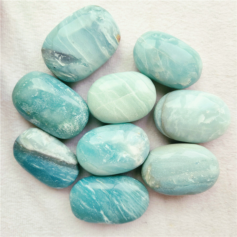 Wholesale Natural high quality sky blue crystal palm stone caribbean calcite palm for sale