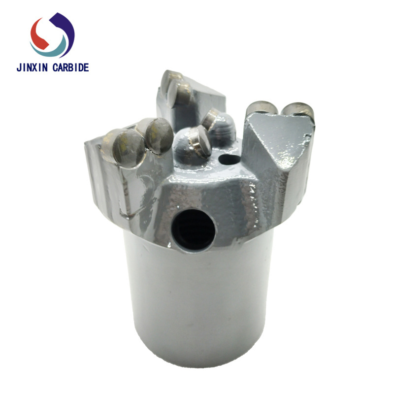 Three-wing reinforced concave coreless drill bit for mining