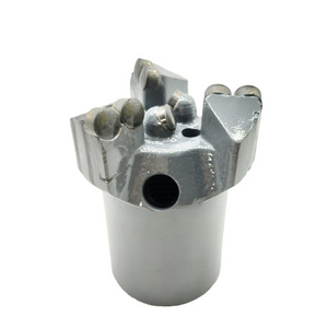 Three-wing reinforced concave coreless drill bit for mining