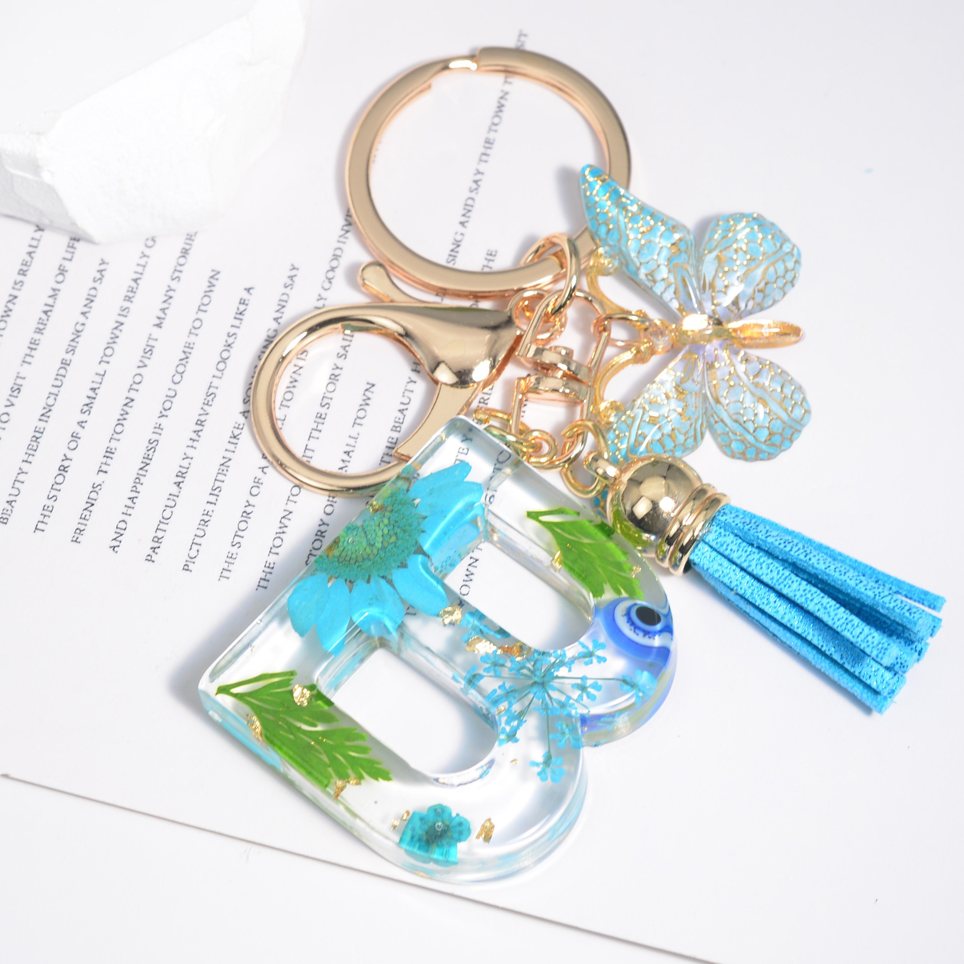 Hot Selling Flower Tassel Butterfly Keychain Eye Letter Keychain Initial A-Z Resin Keychain