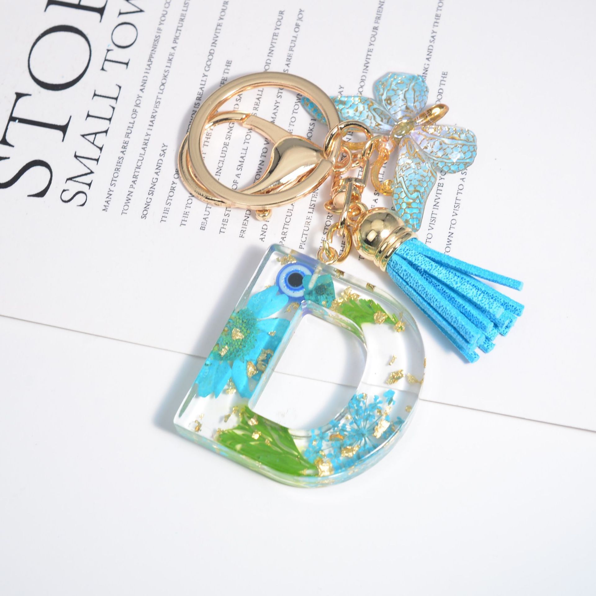 Hot Selling Flower Tassel Butterfly Keychain Eye Letter Keychain Initial A-Z Resin Keychain