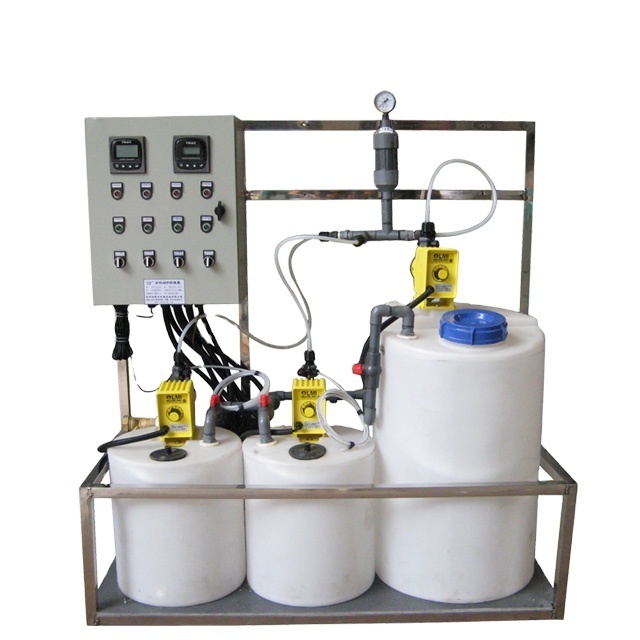 Boiler scale inhibitor and biocide chemical dosing system for heating system