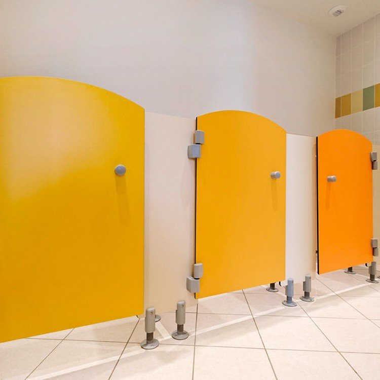 Colorful children use toilet partitions made with HPL compact laminate