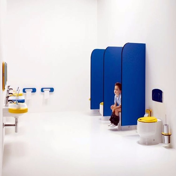 Colorful children use toilet partitions made with HPL compact laminate