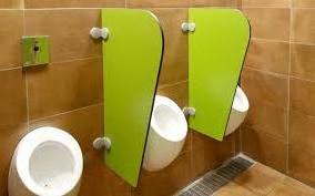 Colorful children use toilet partitions made with HPL compact laminate