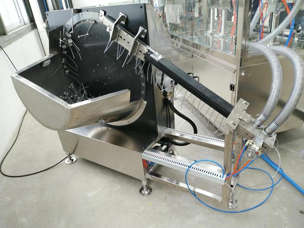 automatic aerosol valve insertion machine