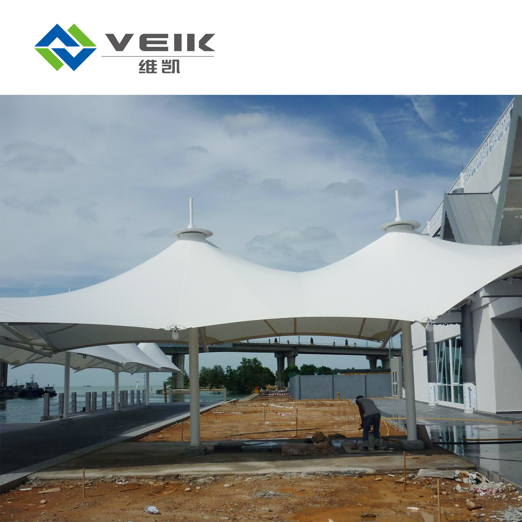 Tensioned fabric shade tensile umbrella membrane structure