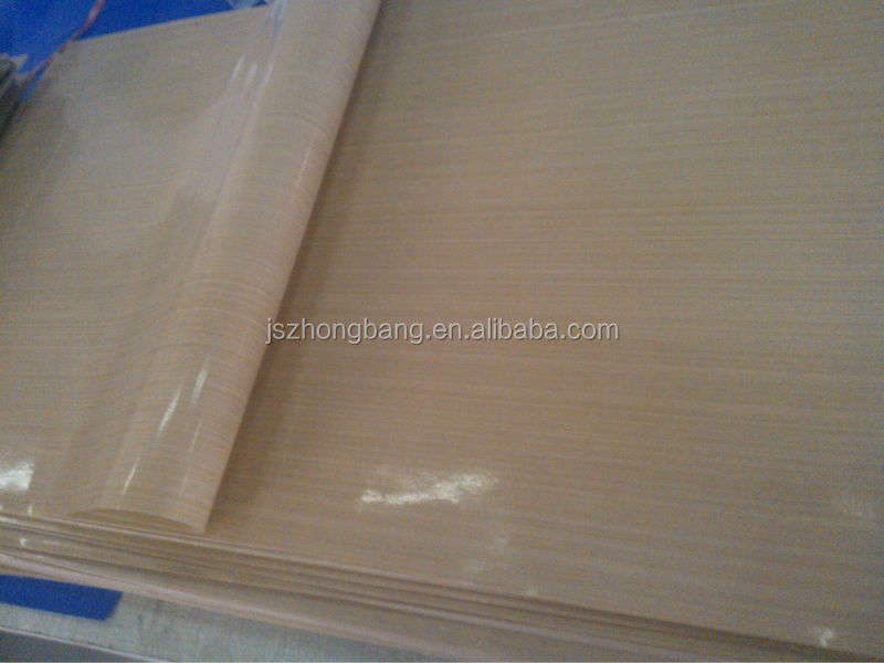 Woven fiberglass fabric coated with PTFE