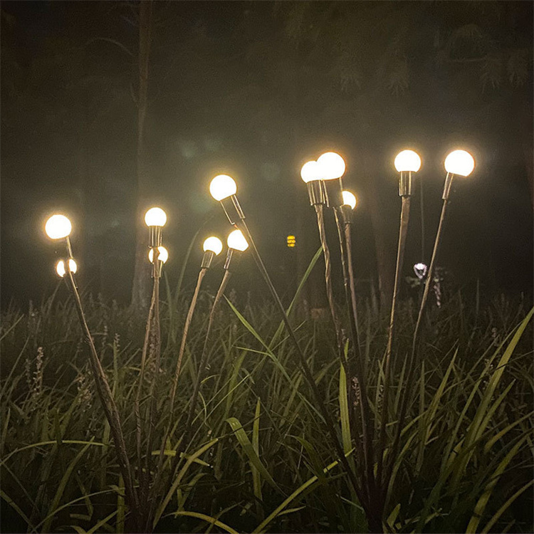 Outdoor little bulbs on wires in the grass and swing around garden solar portable light firefly solar garden light