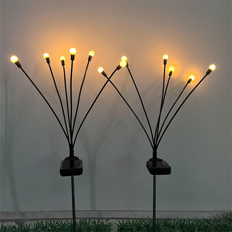 Outdoor little bulbs on wires in the grass and swing around garden solar portable light firefly solar garden light