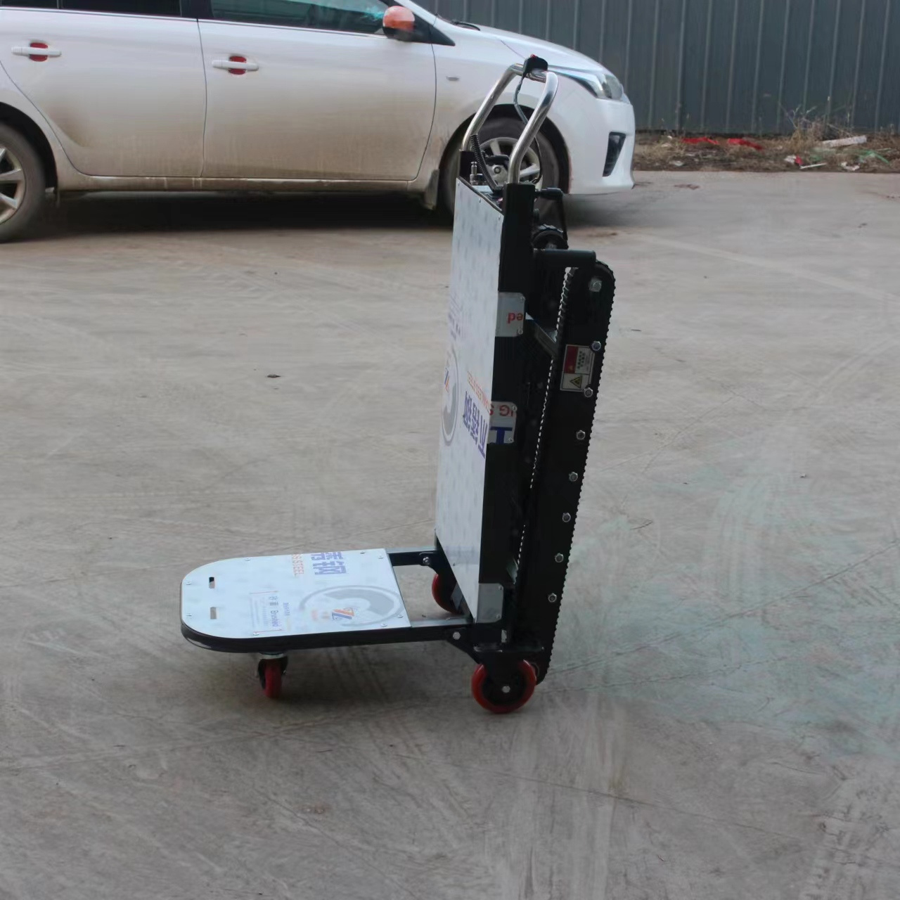 China Factory wholesale portable automatic hand truck electric stair climber pallet truck trolley