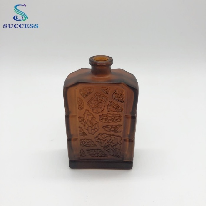 square brown 60ml glass perfume bottle with decorative pattern