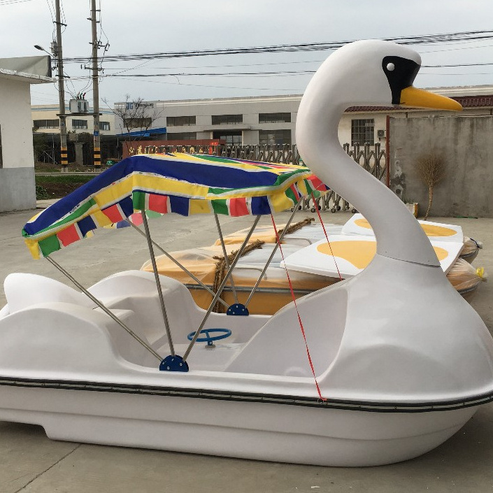 Disassembled swan fiberglass pedal boat