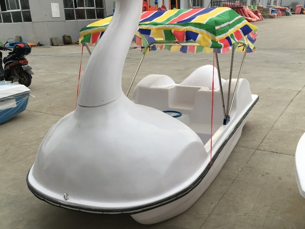 Disassembled swan fiberglass pedal boat