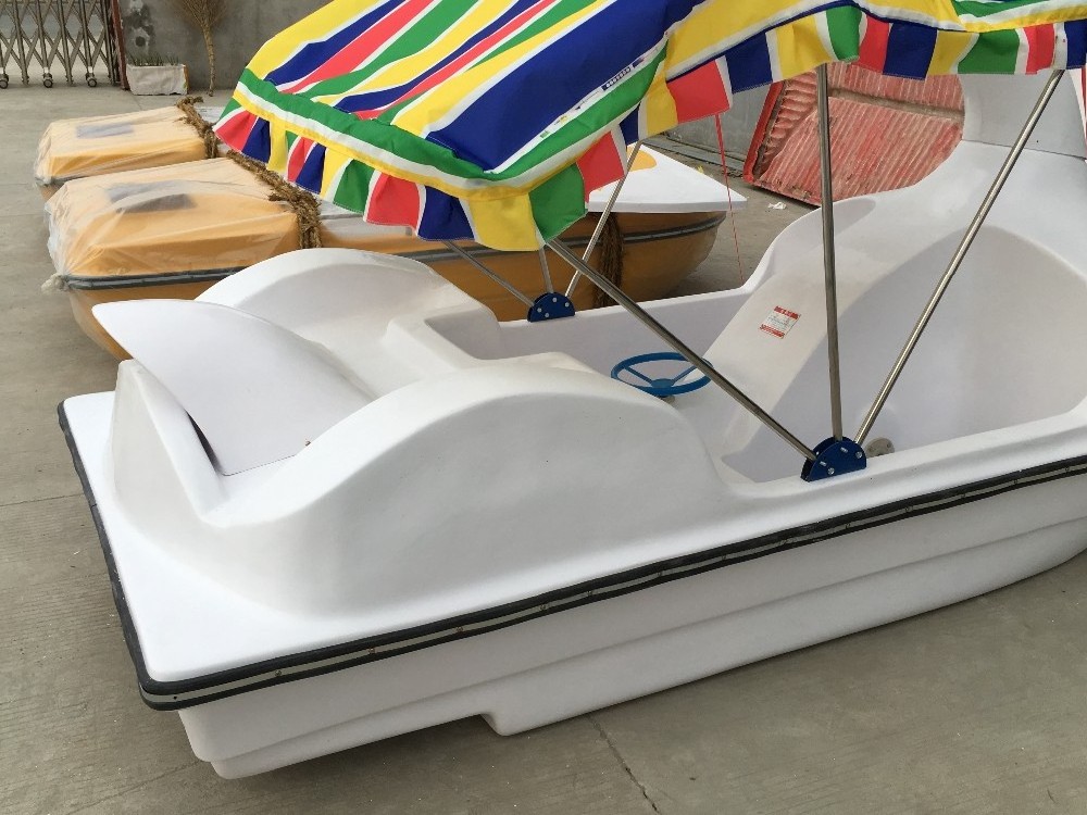 Disassembled swan fiberglass pedal boat