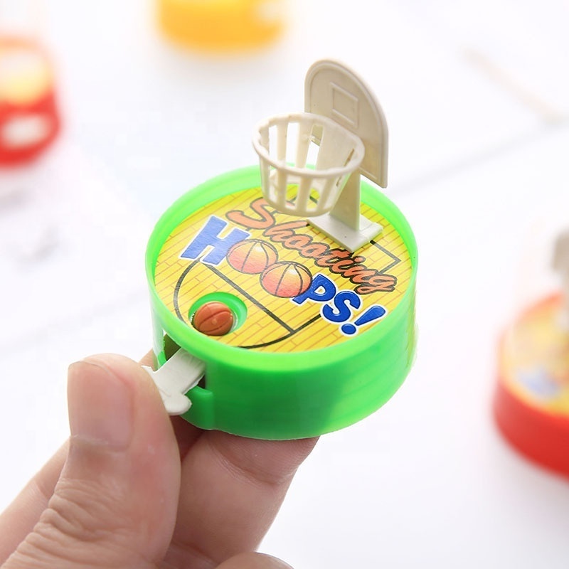 Manufacturers supply handheld mini shooting machine finger basketball hands-on children's catapult educational toys