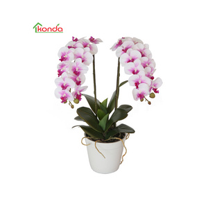 Vivid fake artificial flowers orchid plants vertical garden