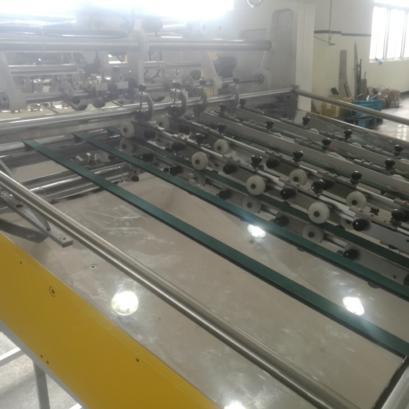 Automatic paper bag making machine with top reinforced and top folding and holes panching