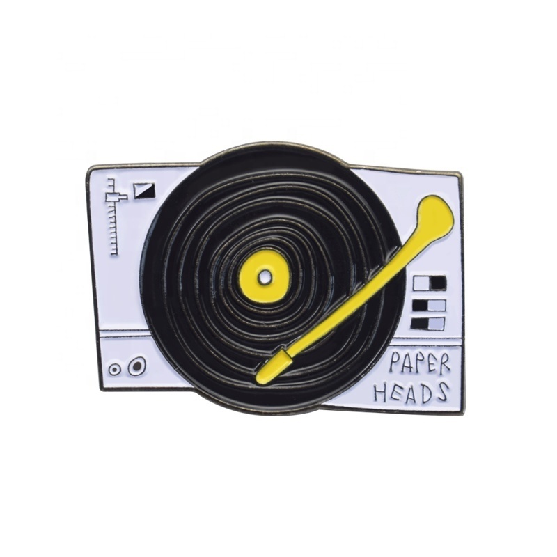 Wholesale custom zinc alloy material black and white tape machine color fist metal badge