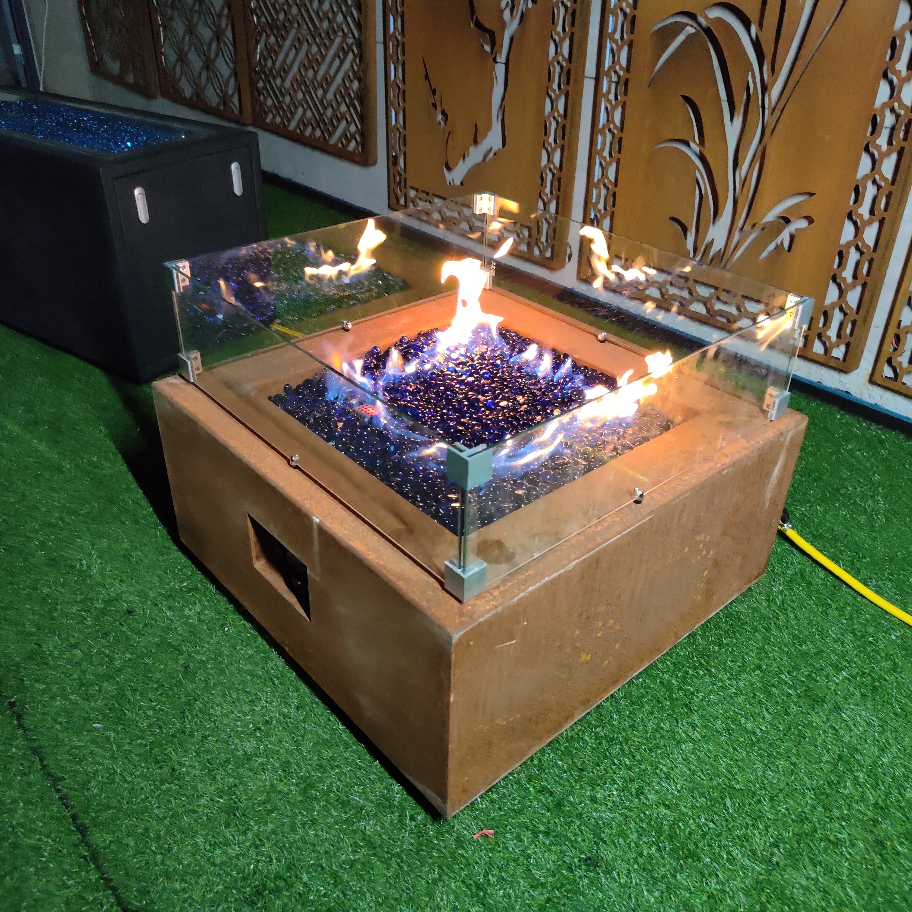 Rectangle outdoor gas fire pit table in garden