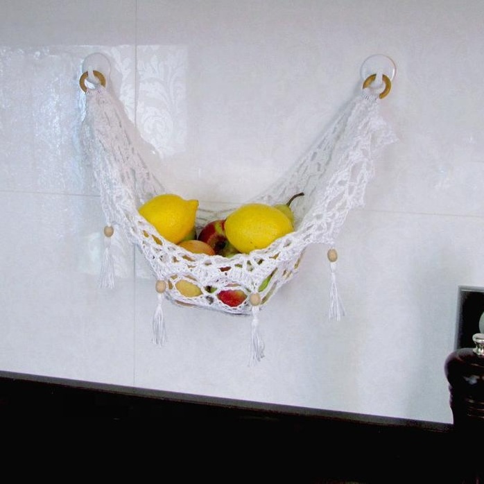 Handcrafted cotton macrame fruit hammocks with gold metal hooks from Vietnam