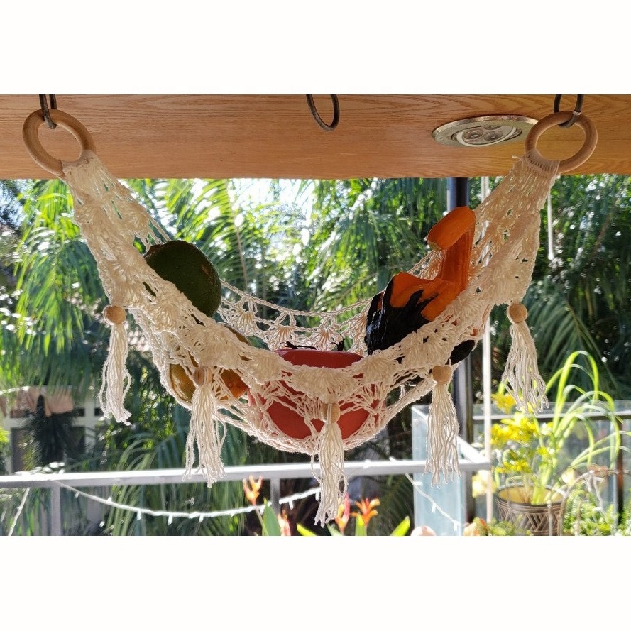 Handcrafted cotton macrame fruit hammocks with gold metal hooks from Vietnam