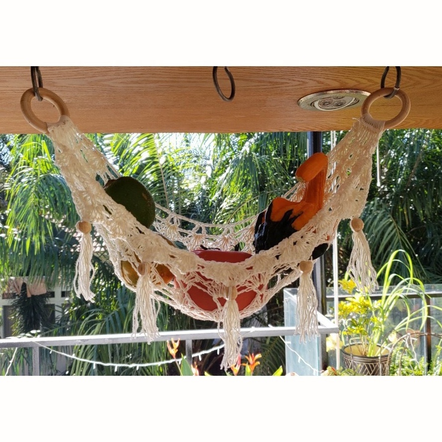 Handcrafted cotton macrame fruit hammocks with gold metal hooks from Vietnam