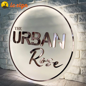 Acrylic logo with LED light. Golden mirror letters, business signs for beauty salon, boutique, barber shop